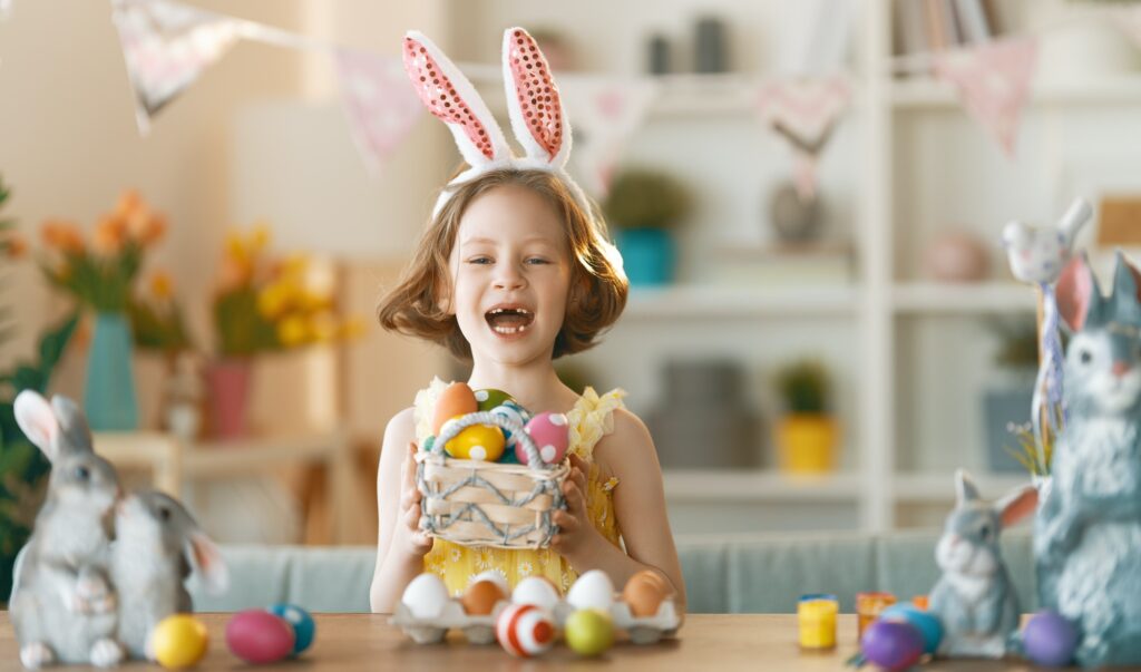 child painting eggs